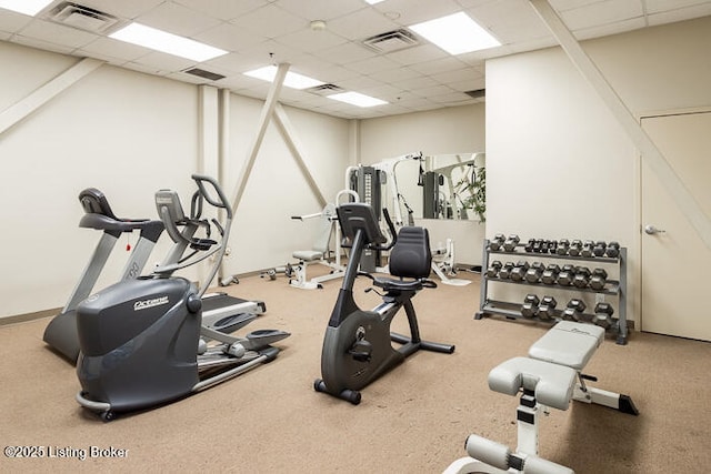 exercise room featuring a paneled ceiling and visible vents