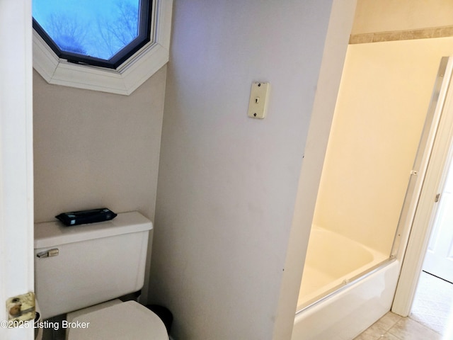 bathroom featuring tile patterned flooring and toilet