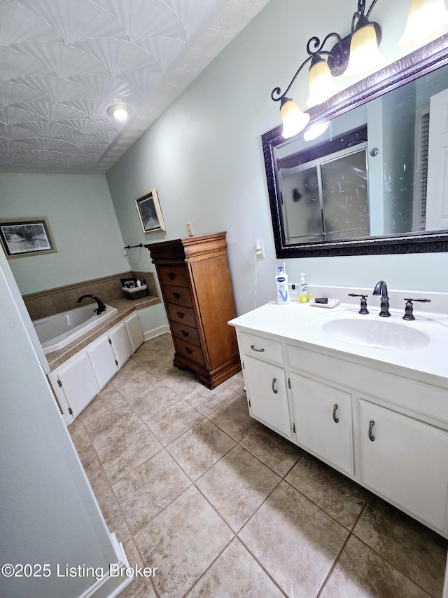 full bath with tile patterned flooring, a shower stall, a bath, and vanity