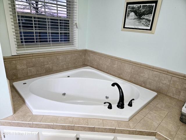 full bathroom with a jetted tub