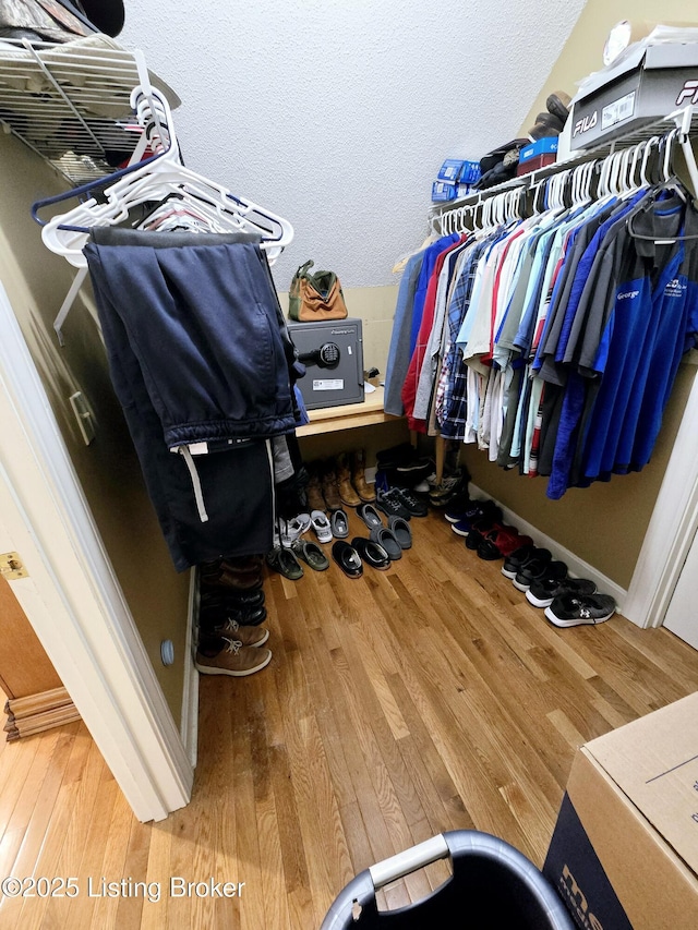 spacious closet with wood finished floors