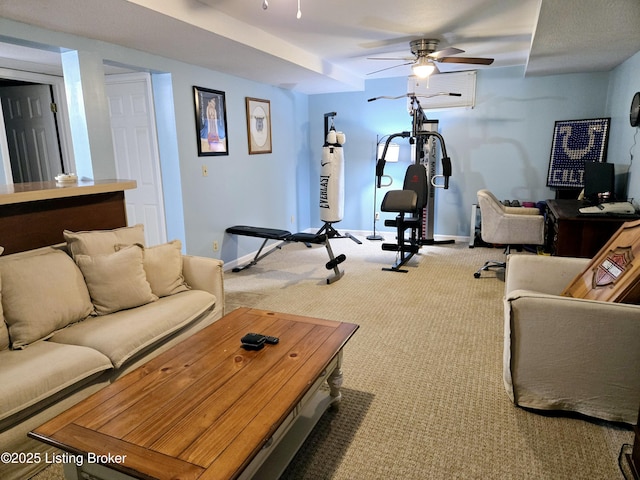 workout room featuring carpet, a ceiling fan, and baseboards