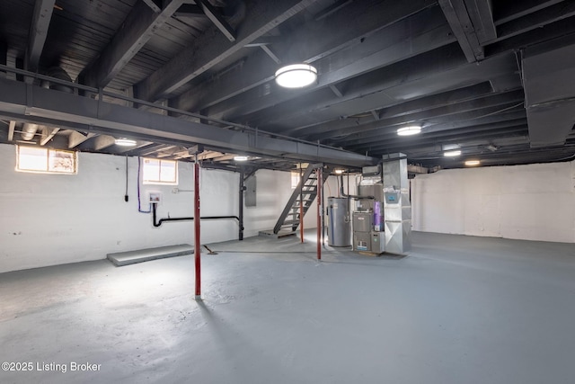 below grade area featuring gas water heater, stairway, and heating unit