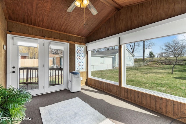 sunroom / solarium featuring a wealth of natural light, wood ceiling, and lofted ceiling with beams