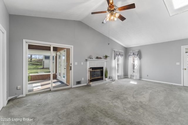 unfurnished living room with visible vents, carpet, a glass covered fireplace, and a ceiling fan