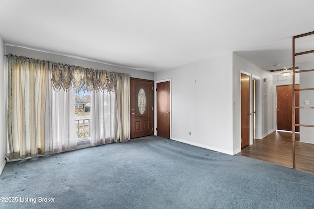 interior space featuring visible vents and baseboards