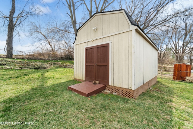 view of shed featuring fence