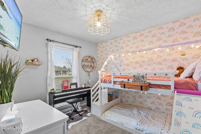 carpeted bedroom with wallpapered walls and a textured ceiling