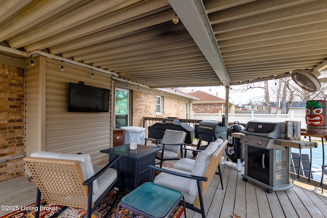 deck with fence and grilling area