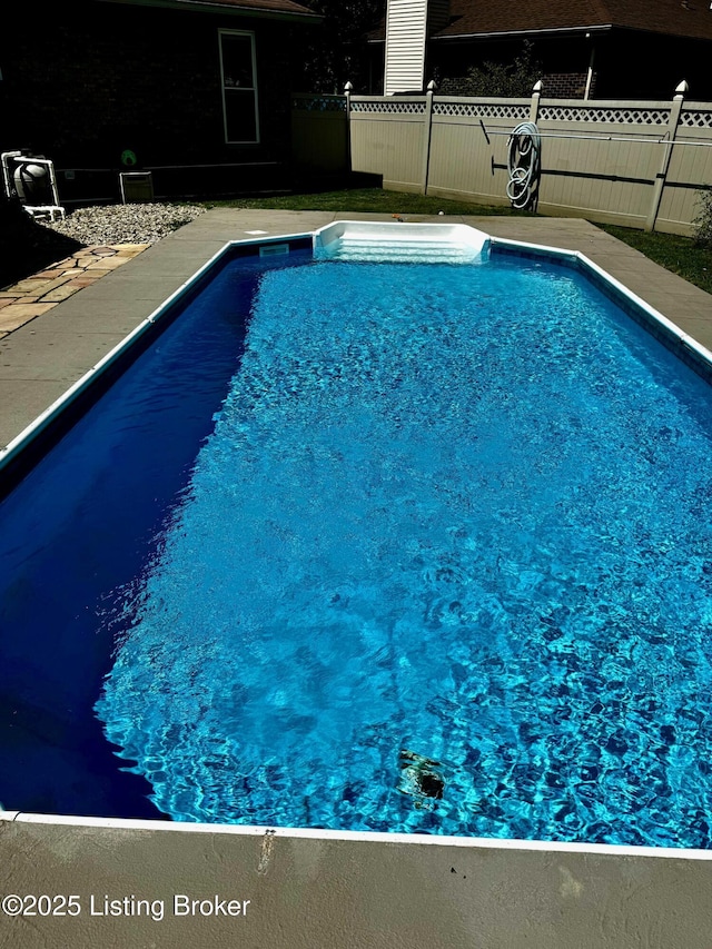 view of pool with fence and a fenced in pool