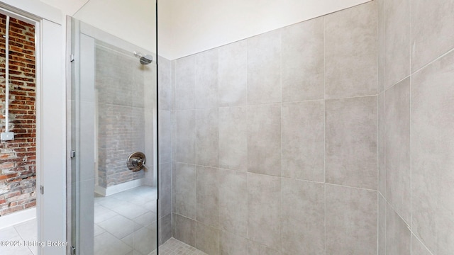 bathroom with a tile shower