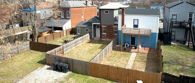 view of yard with a residential view and a fenced backyard