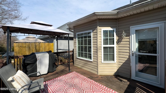 wooden deck featuring a gazebo and grilling area