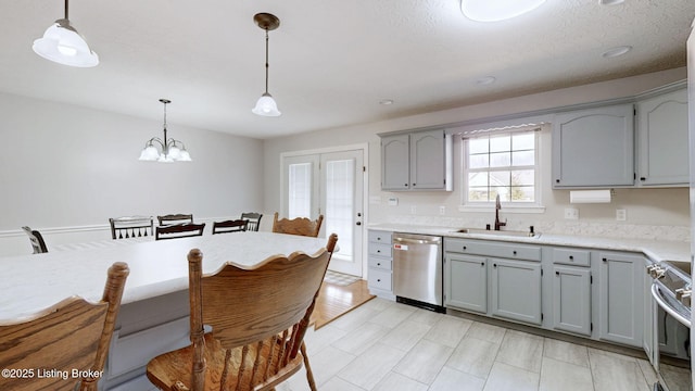 kitchen with a sink, stove, dishwasher, and gray cabinetry