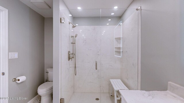 full bathroom with recessed lighting, a marble finish shower, and toilet