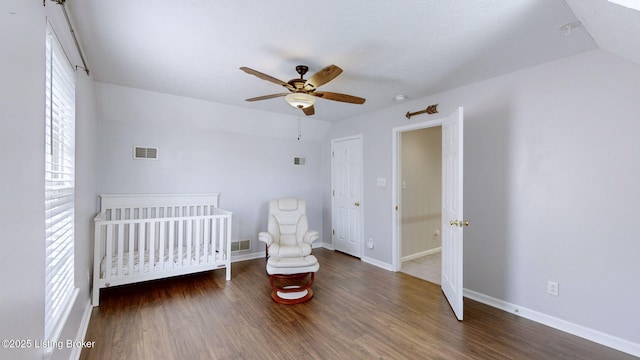 unfurnished bedroom with visible vents, baseboards, and wood finished floors