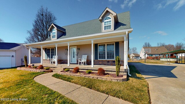 cape cod-style house with a front lawn, a porch, roof with shingles, stone siding, and driveway