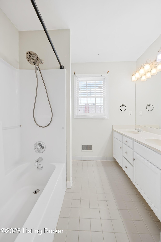 full bathroom featuring double vanity, visible vents, a sink, shower / tub combination, and tile patterned floors