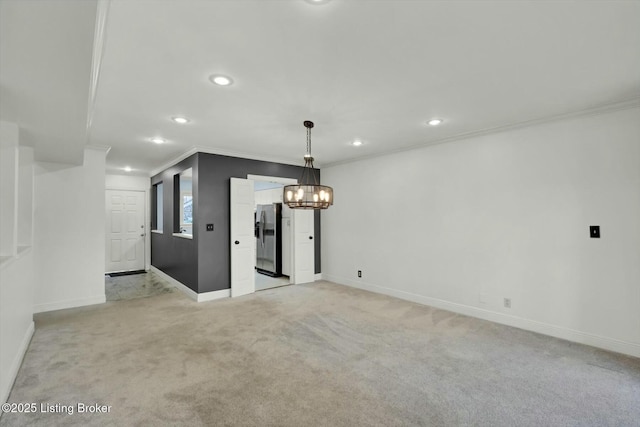 spare room with baseboards, light colored carpet, crown molding, a chandelier, and recessed lighting