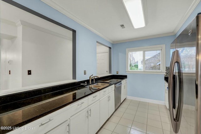 kitchen with stainless steel appliances, visible vents, ornamental molding, a sink, and dark stone countertops