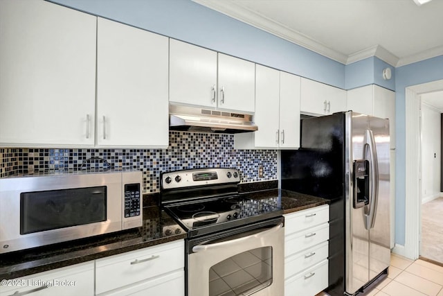 kitchen featuring appliances with stainless steel finishes, ornamental molding, under cabinet range hood, white cabinetry, and backsplash