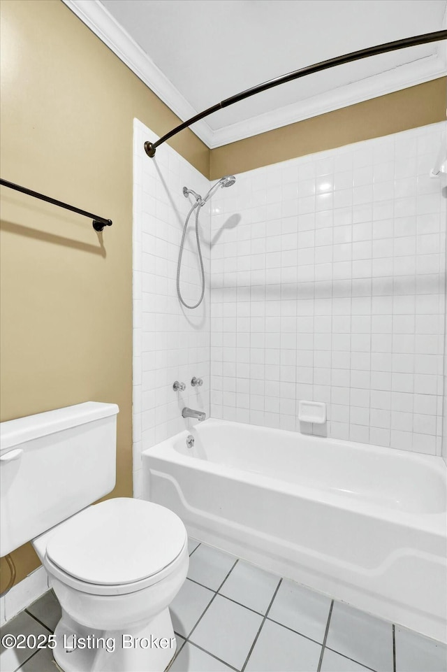 full bath featuring crown molding, shower / bathtub combination, toilet, and tile patterned floors