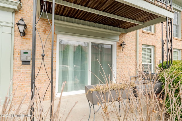 exterior space with brick siding