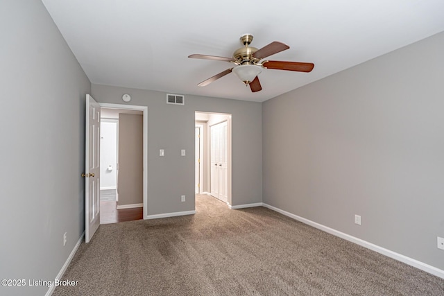 unfurnished bedroom featuring visible vents, baseboards, ceiling fan, and carpet flooring