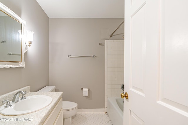 full bathroom with shower / bathtub combination, toilet, vanity, baseboards, and tile patterned floors