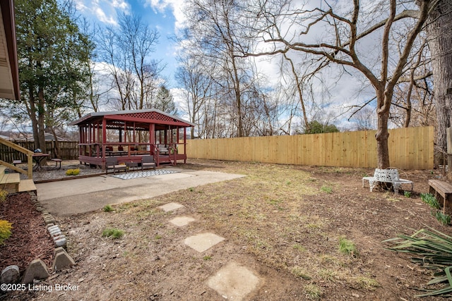 view of yard featuring a fenced backyard and a gazebo