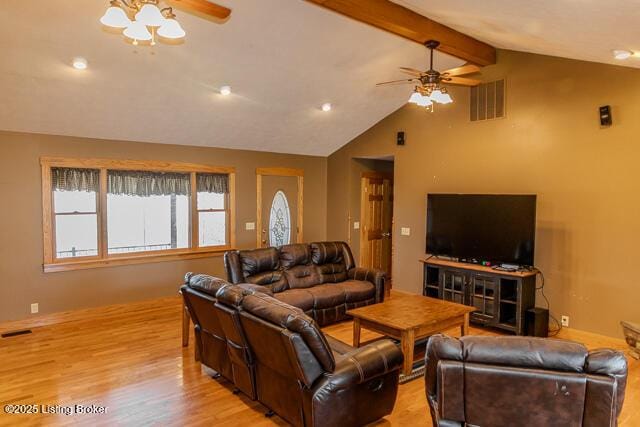 living area with ceiling fan, lofted ceiling with beams, light wood-type flooring, and visible vents
