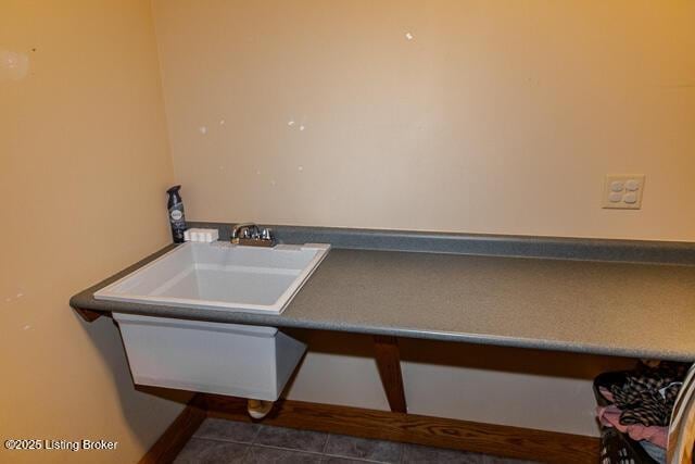 interior space with a sink and tile patterned floors