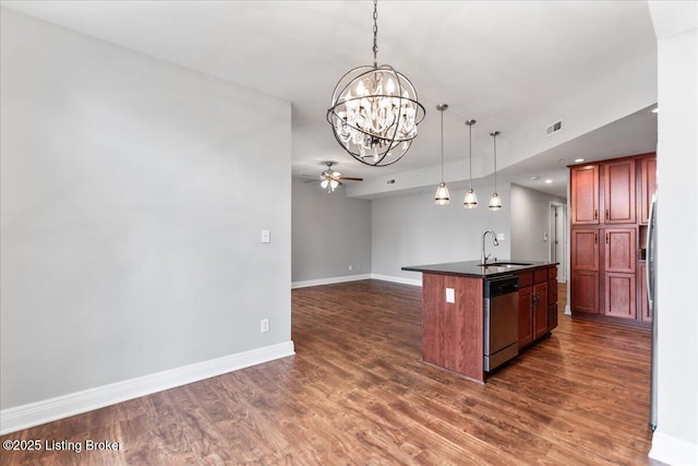 kitchen featuring visible vents, dark wood-type flooring, a sink, stainless steel dishwasher, and dark countertops