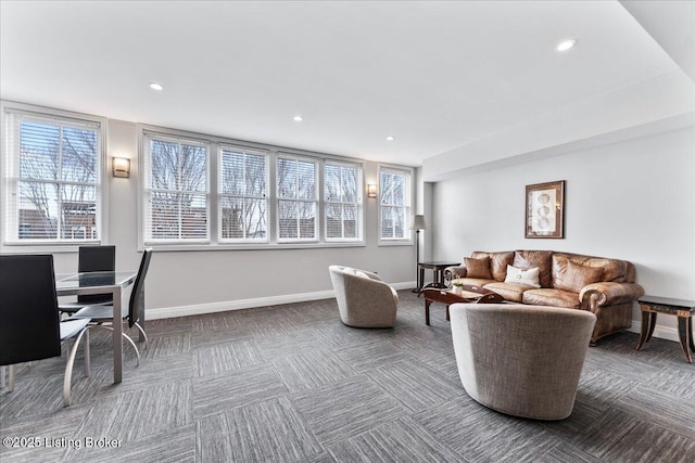 carpeted living room featuring a wealth of natural light, baseboards, and recessed lighting