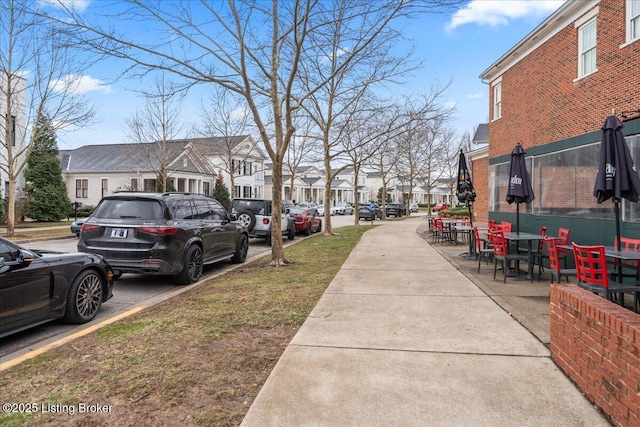 view of street with sidewalks and a residential view