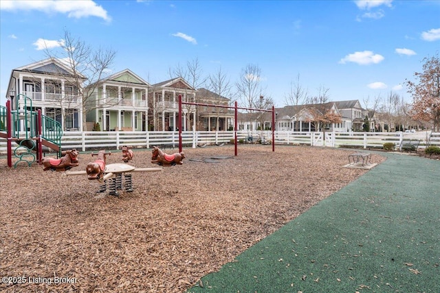 communal playground featuring fence