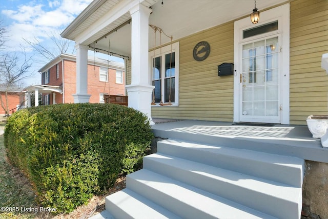 doorway to property featuring a porch