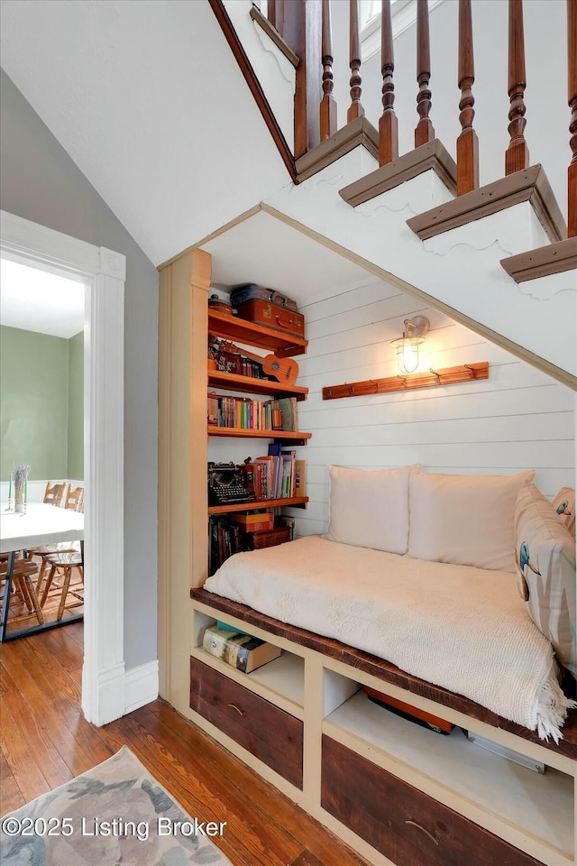 sitting room with lofted ceiling and wood finished floors