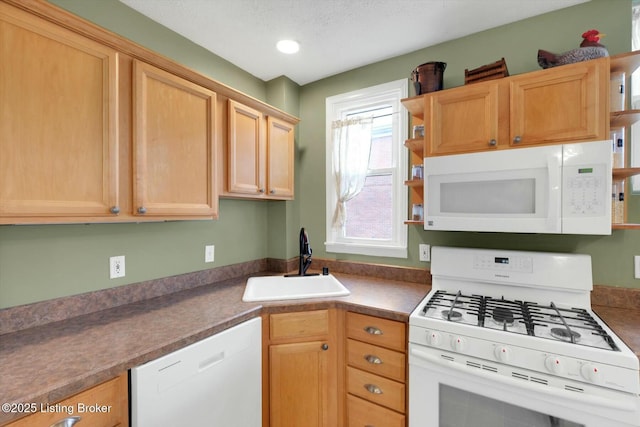 kitchen featuring open shelves, white appliances, and a sink