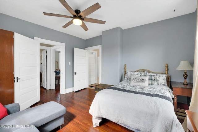 bedroom featuring wood finished floors, baseboards, and ceiling fan