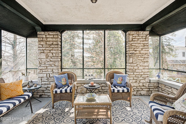 sunroom / solarium featuring outdoor lounge area