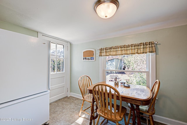 dining room featuring baseboards