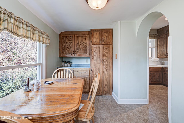 dining area with arched walkways