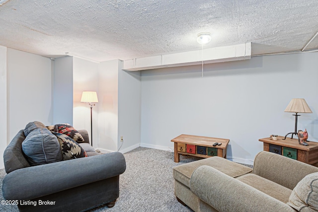 carpeted living area with baseboards and a textured ceiling