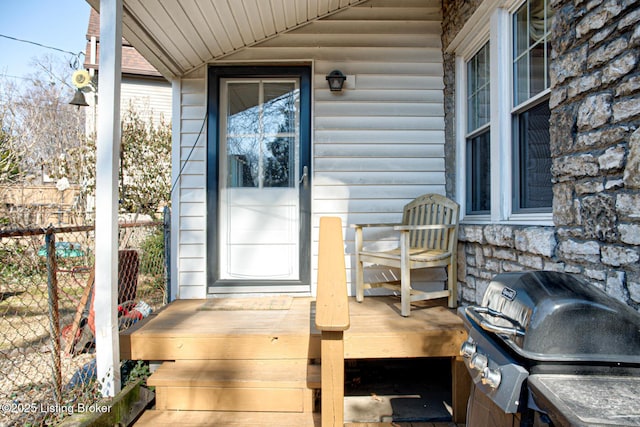 view of patio with grilling area and fence