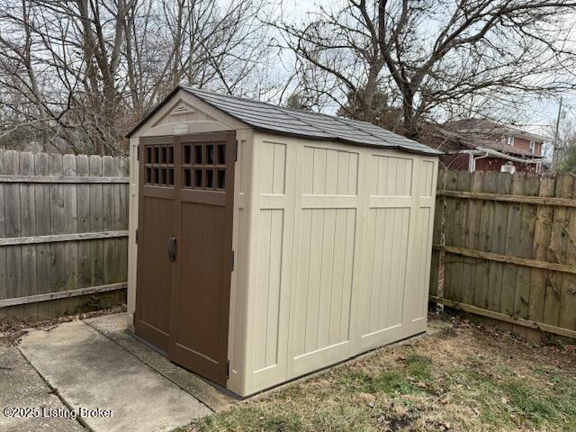 view of shed featuring a fenced backyard