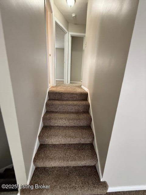 stairway with baseboards