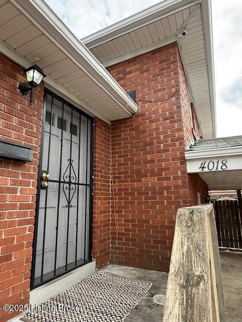 entrance to property with brick siding