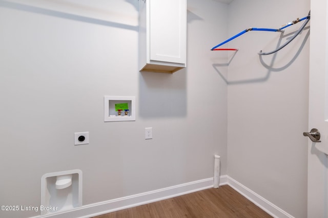 laundry area with hookup for a washing machine, hookup for an electric dryer, wood finished floors, baseboards, and cabinet space