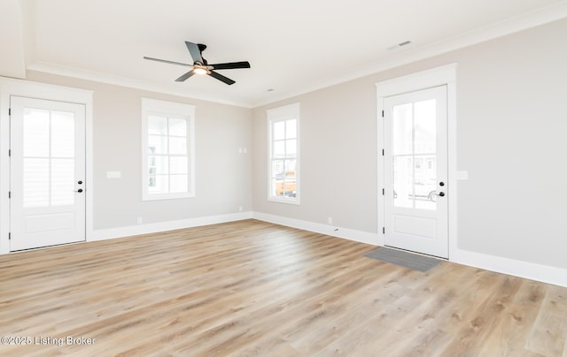 foyer with ornamental molding, baseboards, ceiling fan, and light wood finished floors